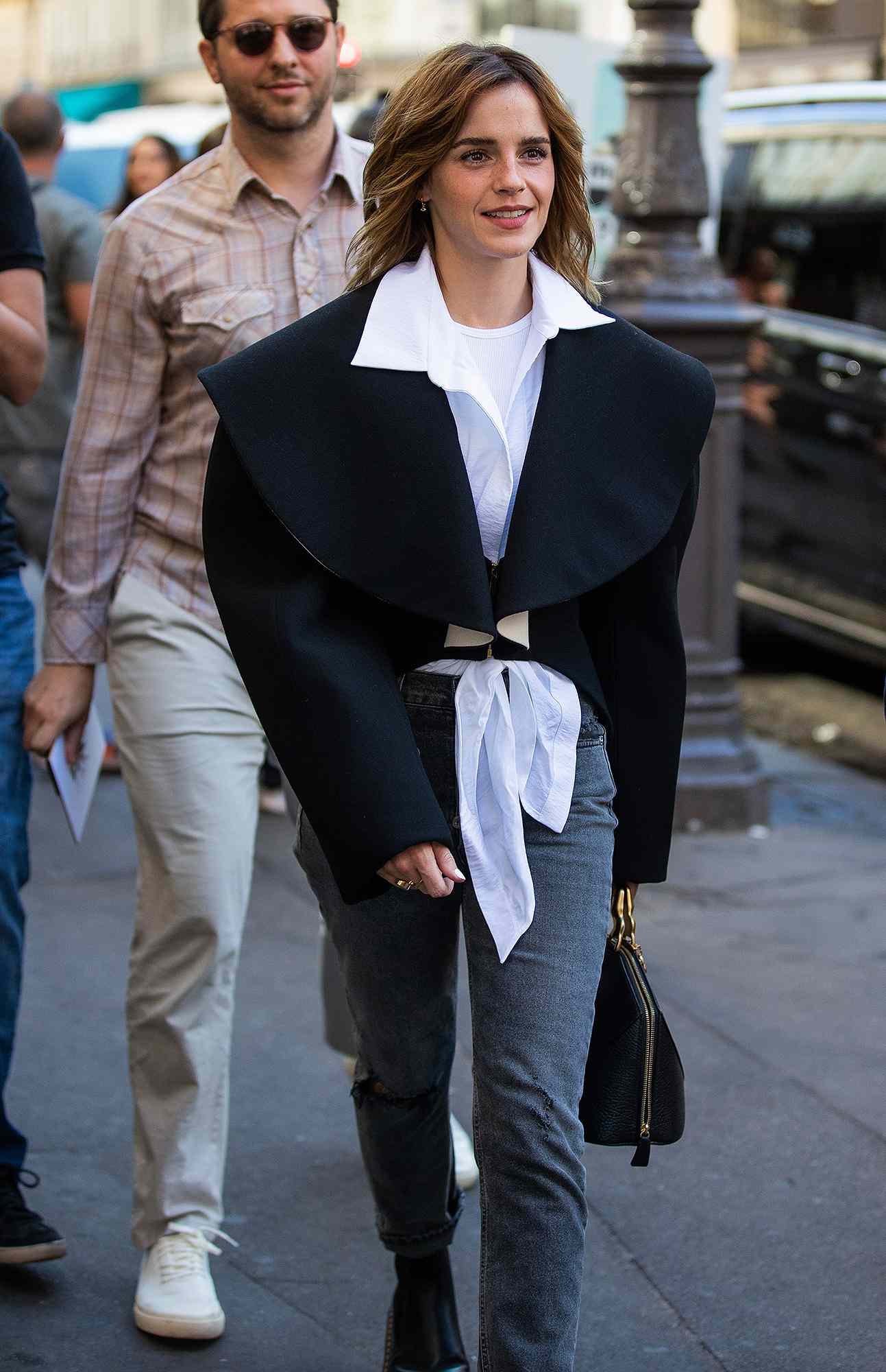 Emma Watson Stands Out at Paris Fashion Week in Ripped Jeans and Dr. Martens